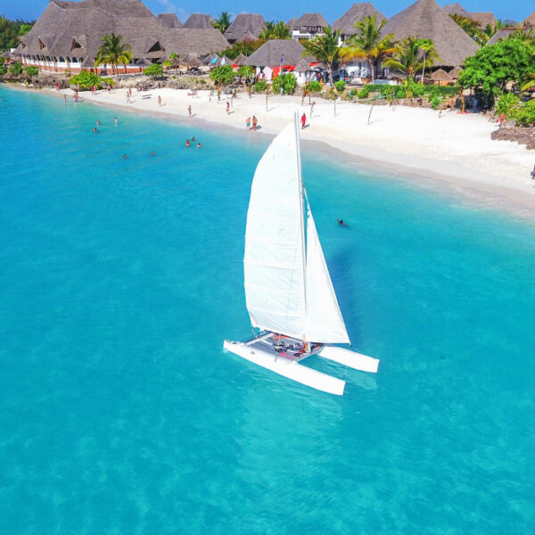 Boat sailing in front of Beach Resort