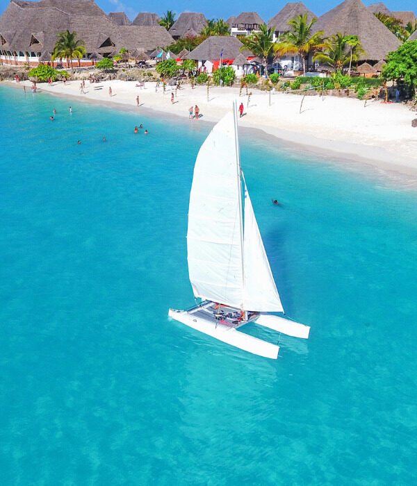Boat sailing in front of Beach Resort
