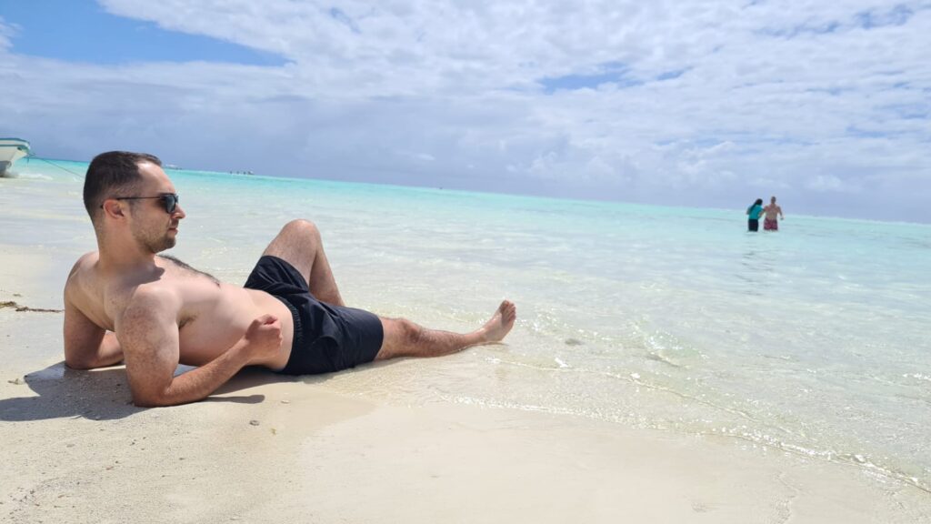 Man Sunbathing Along Zanzibar Island Shores